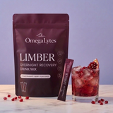 OmegaLytes Limber pouch with stick pack and pomegranate berry drink over ice
